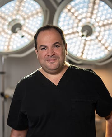 Dr. Darren Smith in surgical scrubs