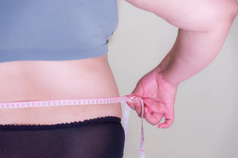 A body of a woman being measured