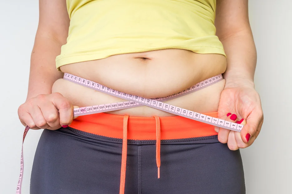 A Woman Measuring Her Stomach